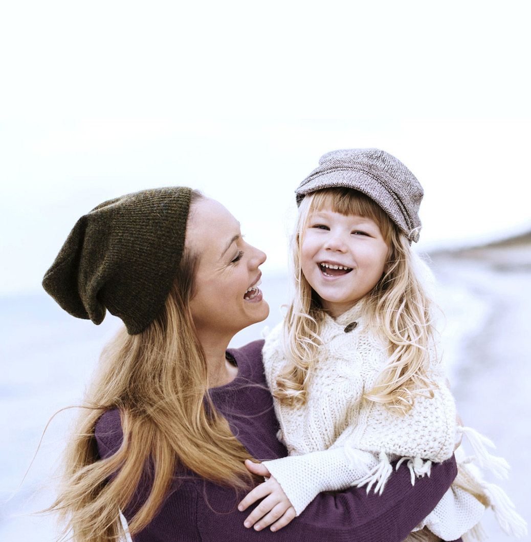 Woman and little girl laughing
